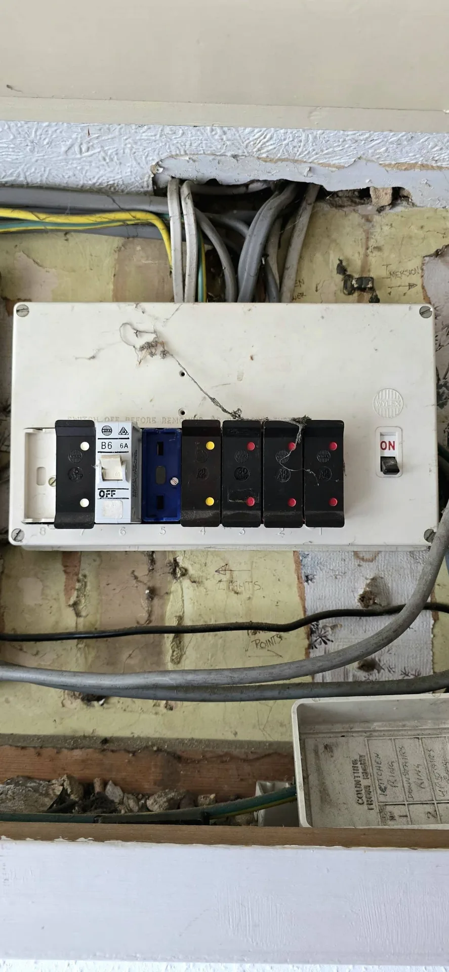 Outdated consumer unit before replacement inspected by Chilvers Electrical
