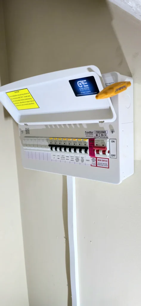 White FuseBox consumer unit with its lid open, labelled circuits and a pink surge protection module in Milton Keynes
